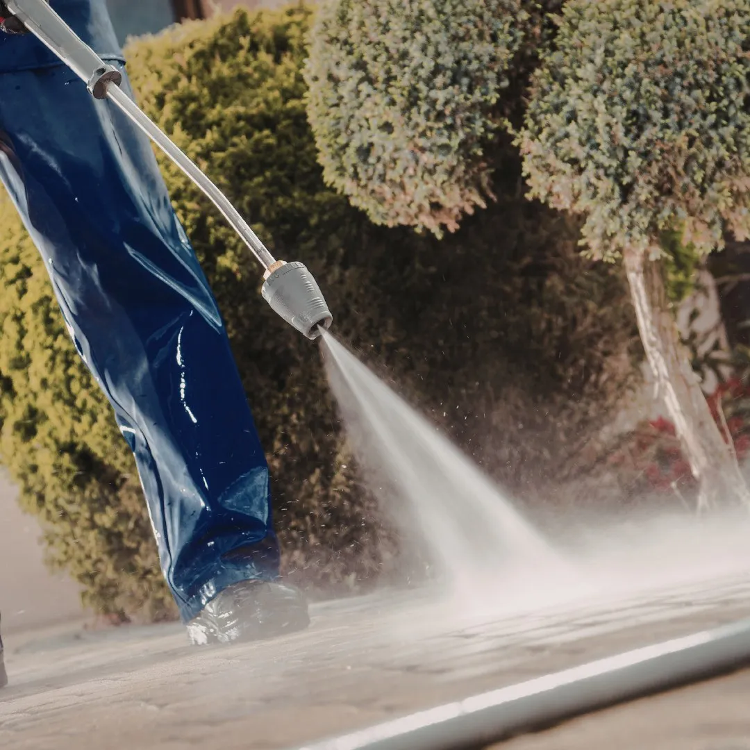 Pressure washing an outdoor walkway